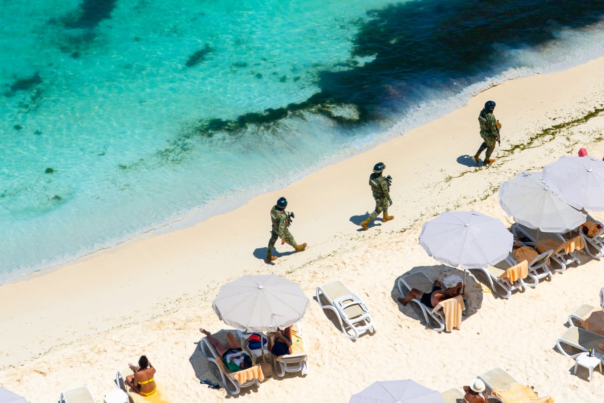 Marina soldiers of Mexican army patrolling beach in Cancun
